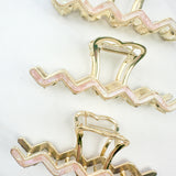 New York Minute: A 4.2-inch metal hair clip with a hinge closure, part of the Sarah Wallace Collection.