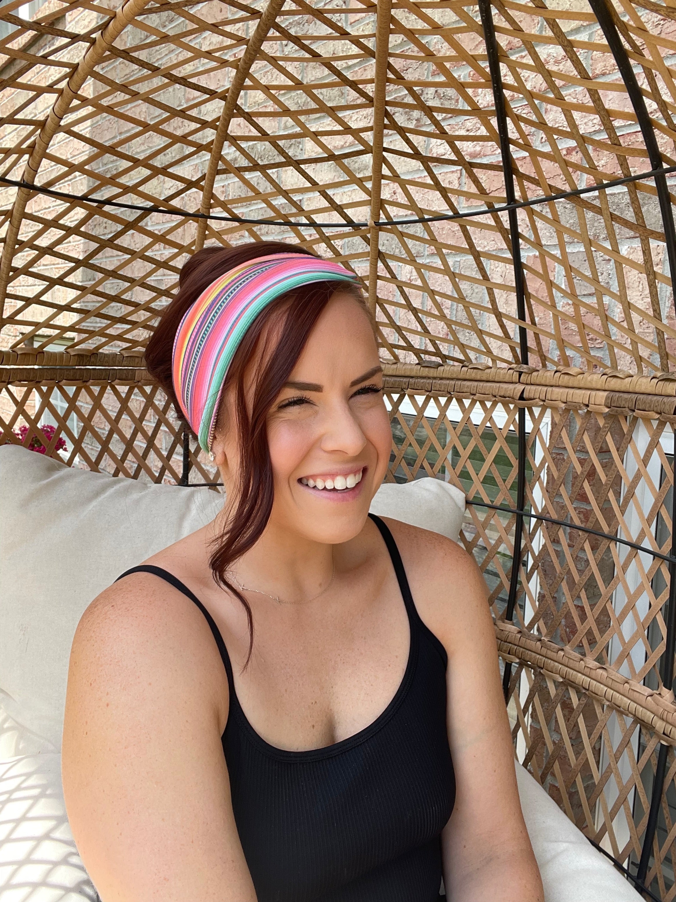 Adult women's headband with orange, purple, yellow, blue, green and red stripes and dots