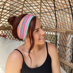 Adult women's headband with orange, purple, yellow, blue, green and red stripes and dots