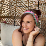 Adult women's headband with orange, purple, yellow, blue, green and red stripes and dots