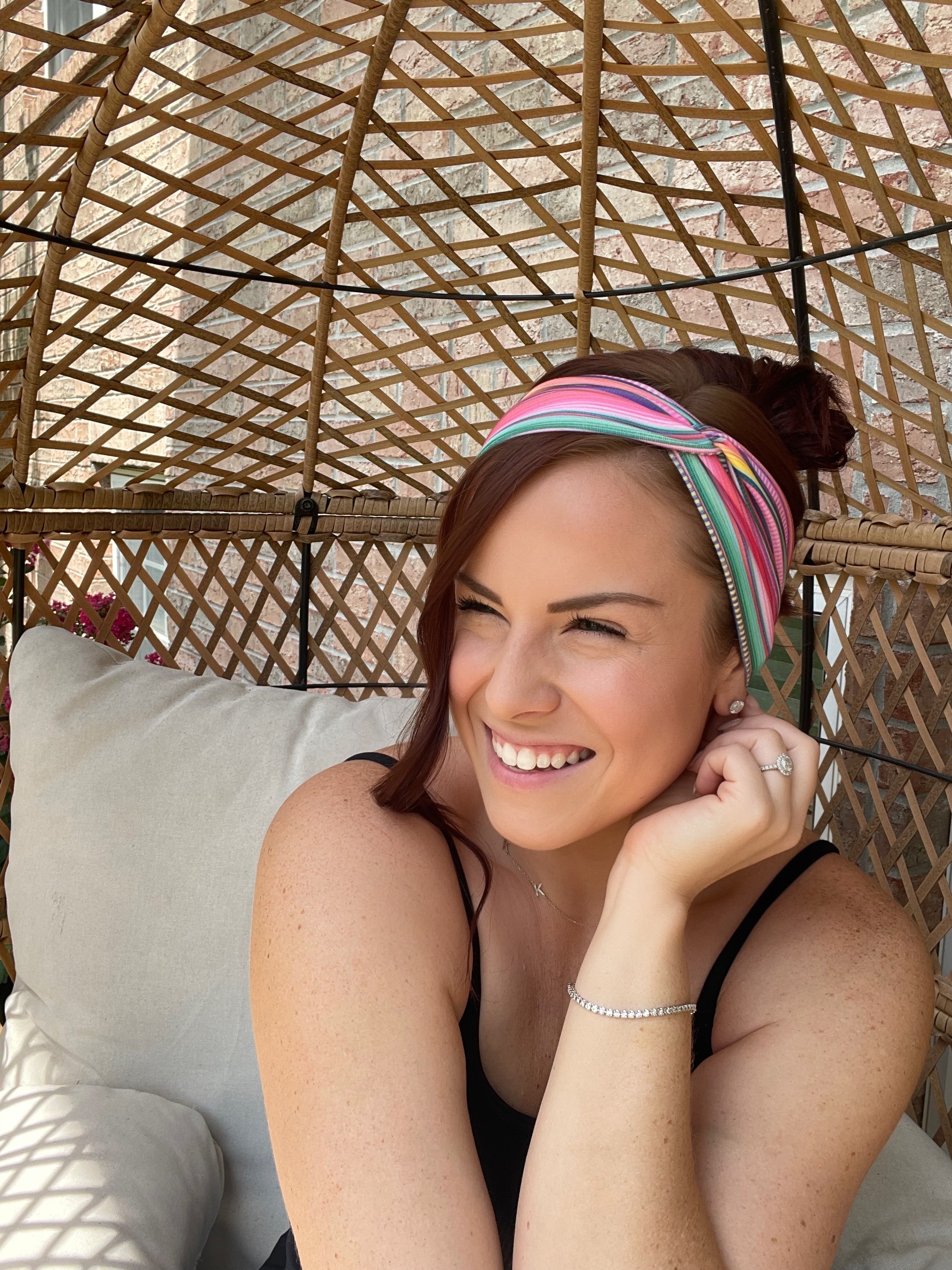 Adult women's headband with orange, purple, yellow, blue, green and red stripes and dots