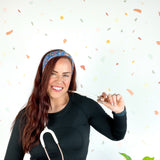 Stork Squad blue headband worn by woman with stethoscope and long hair.