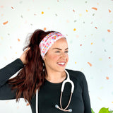 Birthday Specialist Lilac Market Headband worn by a woman with a stethoscope, showcasing a versatile 3-in-1 twist style for confidence and function.