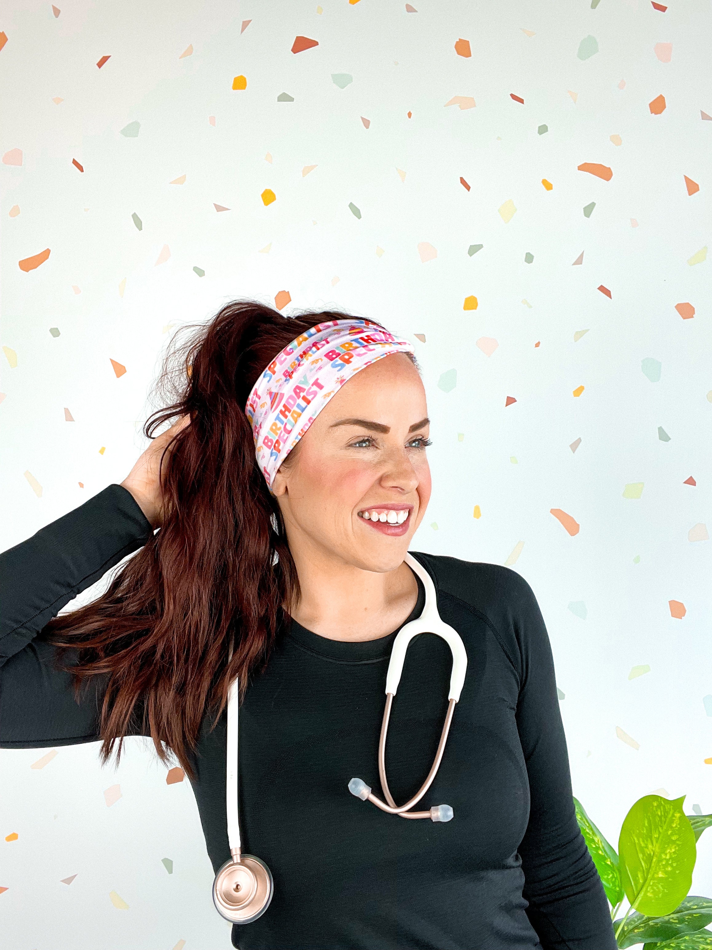 Birthday Specialist Lilac Market Headband worn by a woman with a stethoscope, showcasing a versatile 3-in-1 twist style for confidence and function.