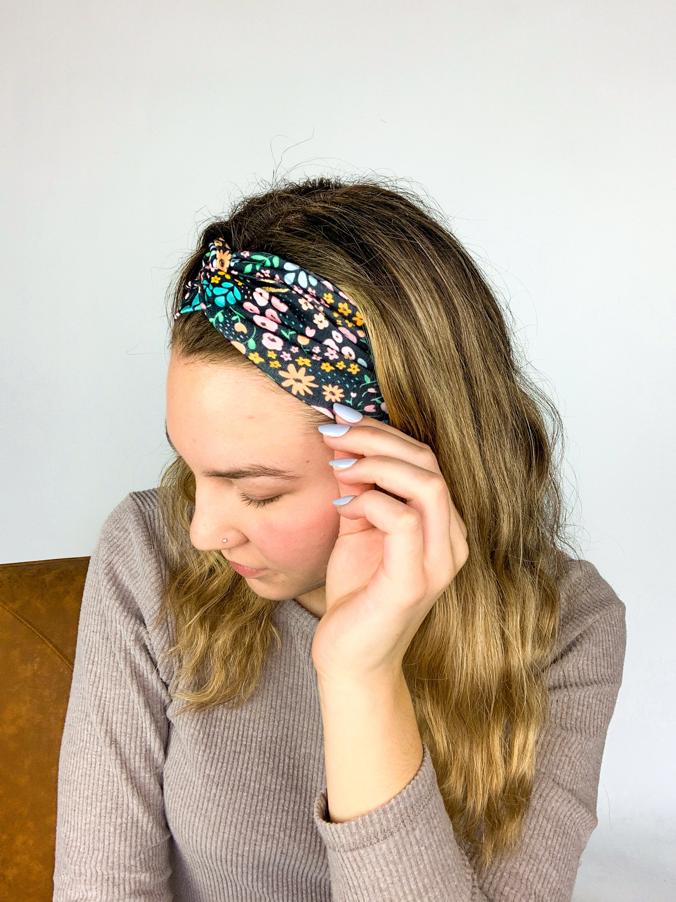 Adult women's black headband with mustard and pink flowers and green and teal greenery