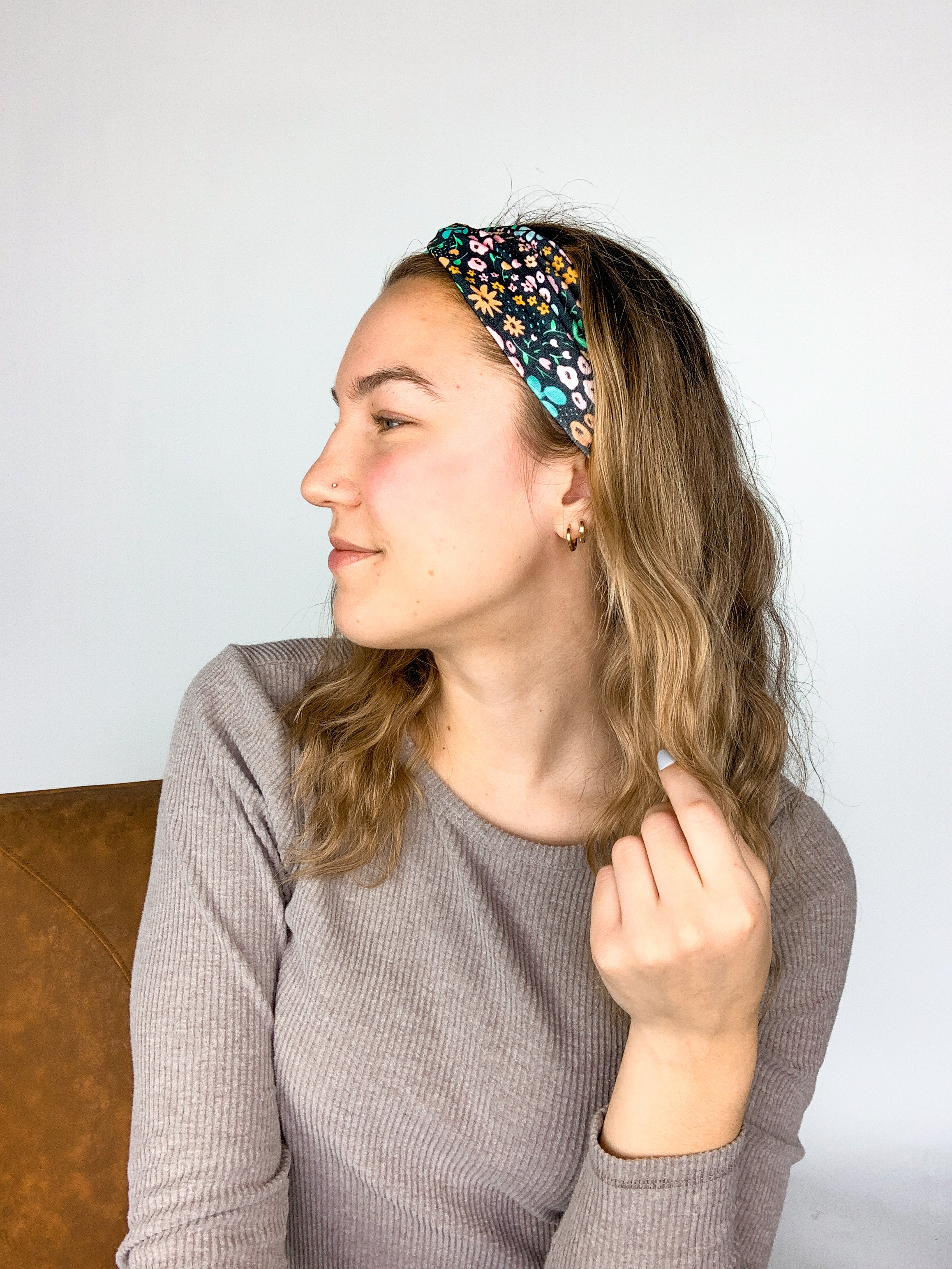 Adult women's black headband with mustard and pink flowers and green and teal greenery