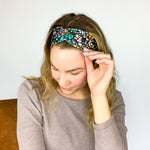 Adult women's black headband with mustard and pink flowers and green and teal greenery
