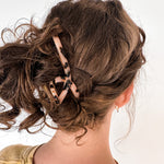 Hair claw clip in marbled white, clear, pink, multi or tortoise in a loop shape