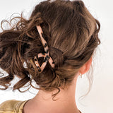 Hair claw clip in marbled white, clear, pink, multi or tortoise in a loop shape