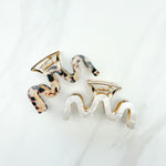 Effortless Lilac Clip, a group of hair clips with a gold, tan and black and white marble zig-zag design, perfect for all hair types and textures.