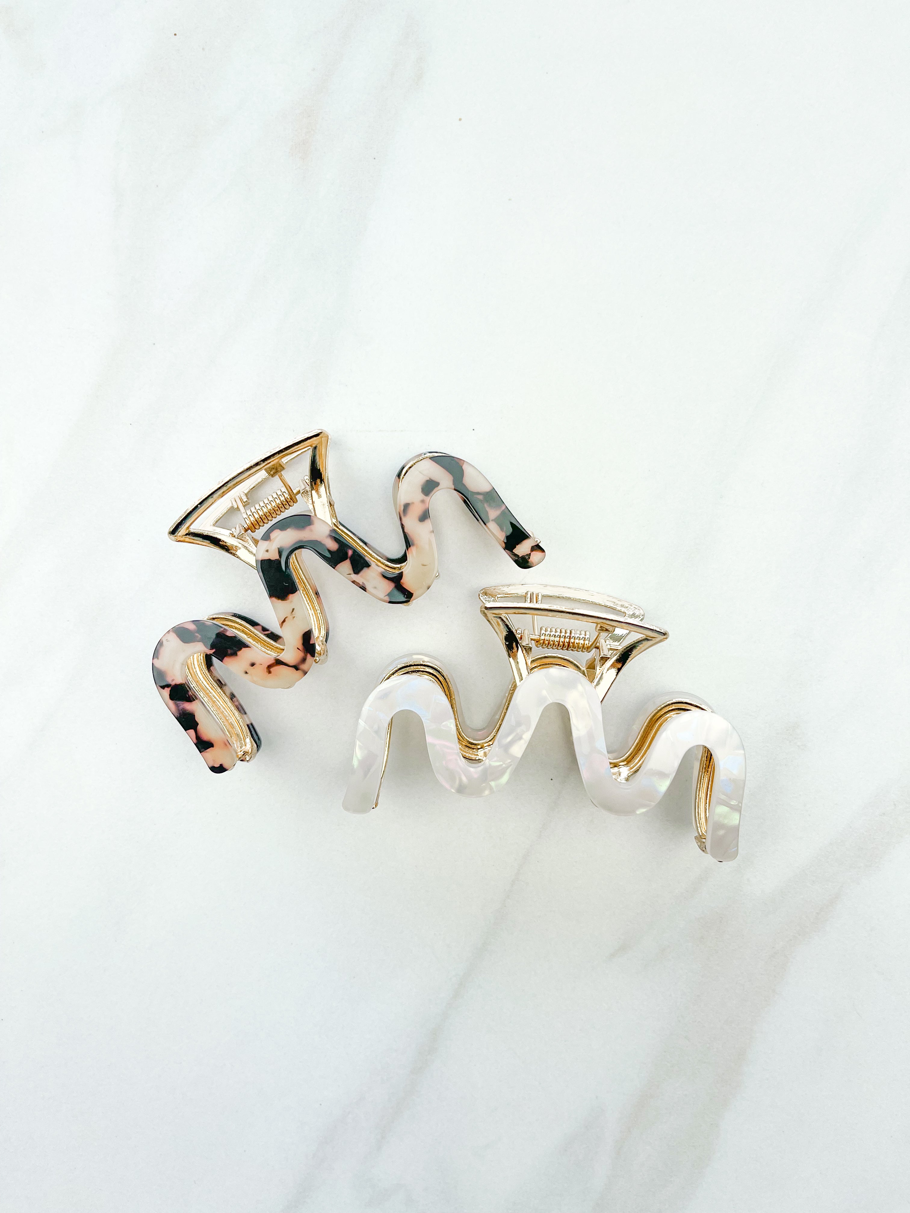 Effortless Lilac Clip, a group of hair clips with a gold, tan and black and white marble zig-zag design, perfect for all hair types and textures.