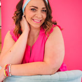 Adult women's wavy striped gradient headband from hot pink, orange, light blue and blue