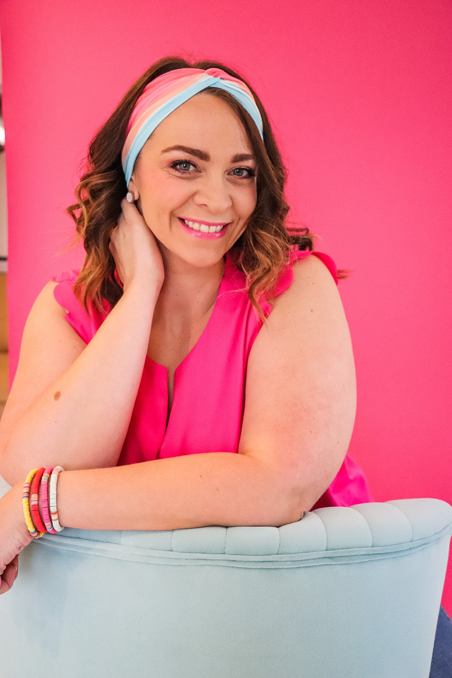 Adult women's wavy striped gradient headband from hot pink, orange, light blue and blue