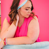 Adult women's wavy striped gradient headband from hot pink, orange, light blue and blue