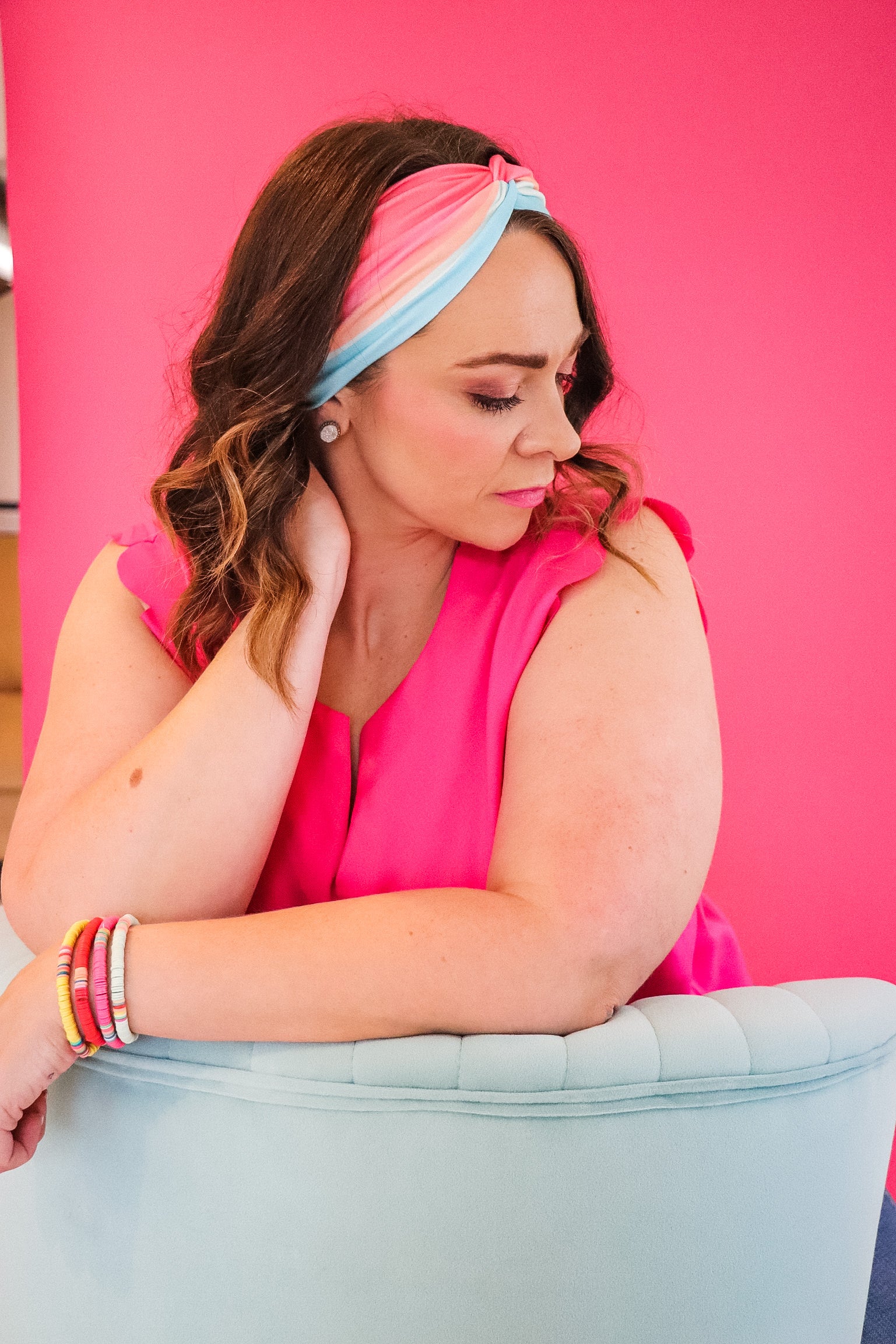 Adult women's wavy striped gradient headband from hot pink, orange, light blue and blue