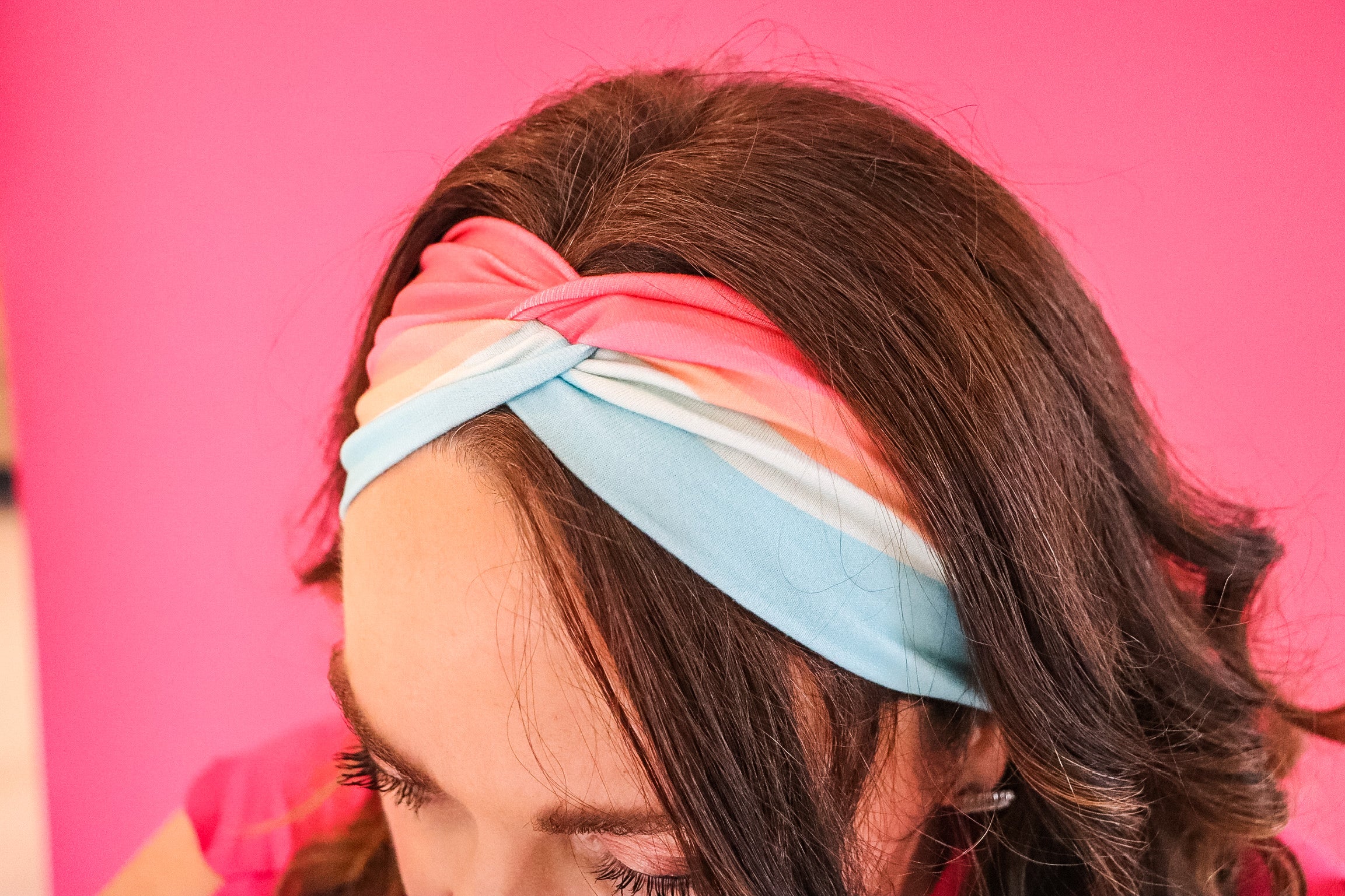Adult women's wavy striped gradient headband from hot pink, orange, light blue and blue