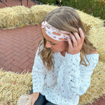 Adult women's blush headband with slices of pumpkin pie and whipped cream and yellow and brown stars