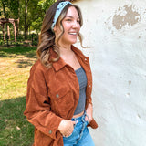 Woman smiling, wearing the Purranormal Activity headband from Lilac Market, featuring a versatile 3-in-1 twist style and buttery-soft, ultra-stretchy poly-knit blend.
