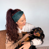 Adult women's black headband with white drawn outline of a playful Dachshund dog