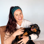 Adult women's black headband with white drawn outline of a playful Dachshund dog