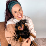 Adult women's black headband with white drawn outline of a playful Dachshund dog