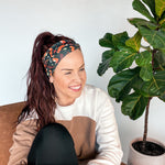 Adult women's black headband with red foxes, orange, green, red and ivory flowers and leaves