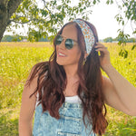 Woman shows off her style in the Fresh From The Market headband, perfect for a long shift or fun play day.