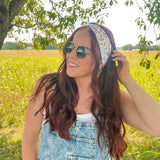 Woman shows off her style in the Fresh From The Market headband, perfect for a long shift or fun play day.