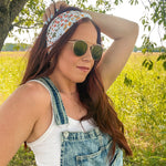 Woman shows off her style in the Fresh From The Market headband, perfect for a long shift or fun play day.