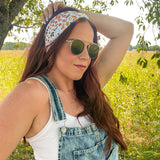 Woman shows off her style in the Fresh From The Market headband, perfect for a long shift or fun play day.