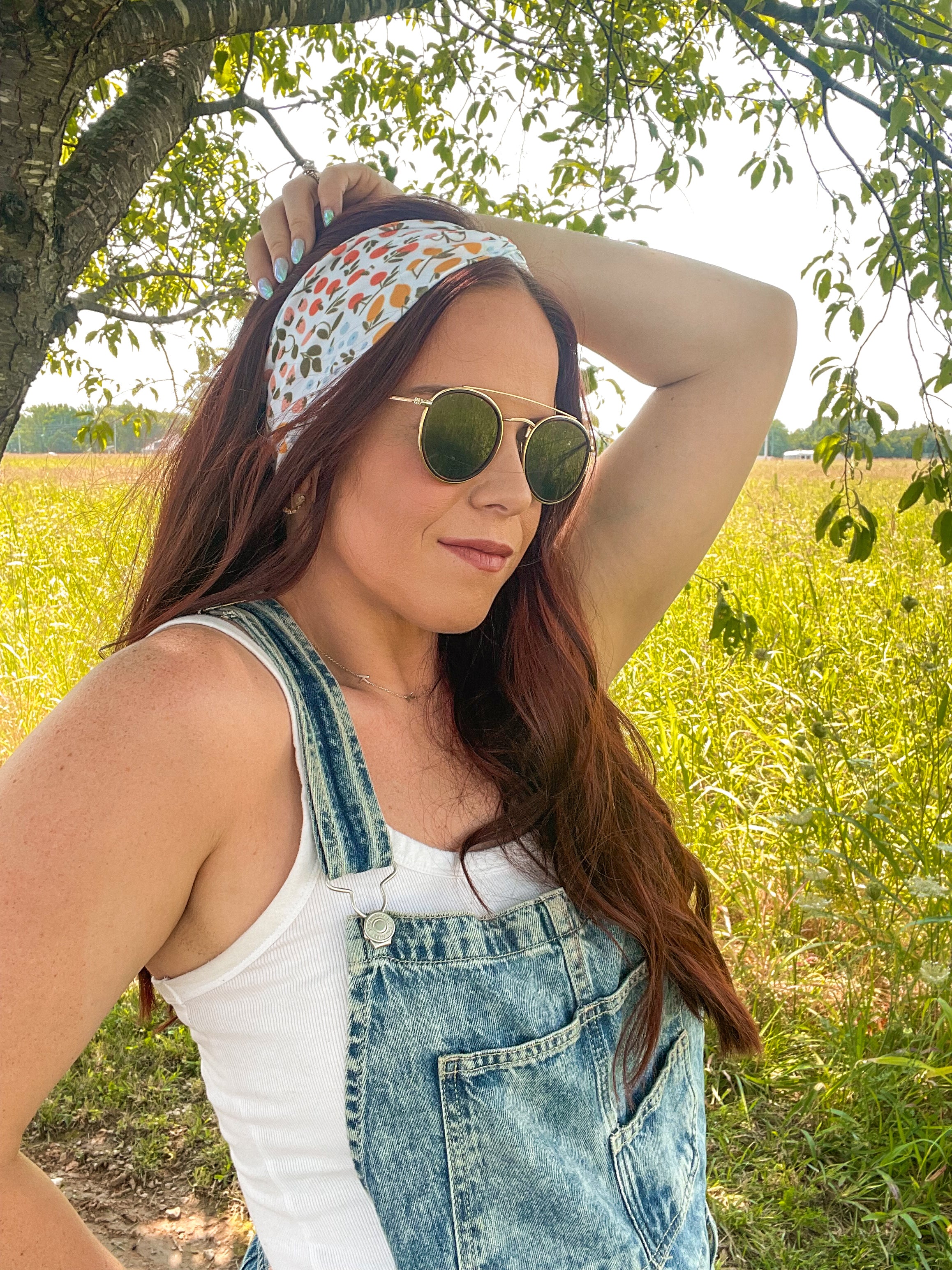 Woman shows off her style in the Fresh From The Market headband, perfect for a long shift or fun play day.
