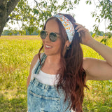 Woman shows off her style in the Fresh From The Market headband, perfect for a long shift or fun play day.