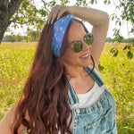Woman in sunglasses confidently wearing the Cherry on Top headband, designed for comfort, versatility, and functionality.