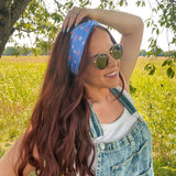 Woman in sunglasses confidently wearing the Cherry on Top headband, designed for comfort, versatility, and functionality.