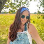 Woman in sunglasses confidently wearing the Cherry on Top headband, designed for comfort, versatility, and functionality.