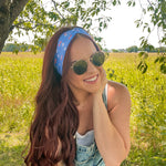 Woman in sunglasses confidently wearing the Cherry on Top headband, designed for comfort, versatility, and functionality.