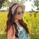 Woman confidently wearing the Simply the Zest headband, capturing its versatile 3-in-1 twist style, perfect for workouts or play.