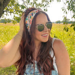 Woman confidently wearing the Simply the Zest headband, capturing its versatile 3-in-1 twist style, perfect for workouts or play.