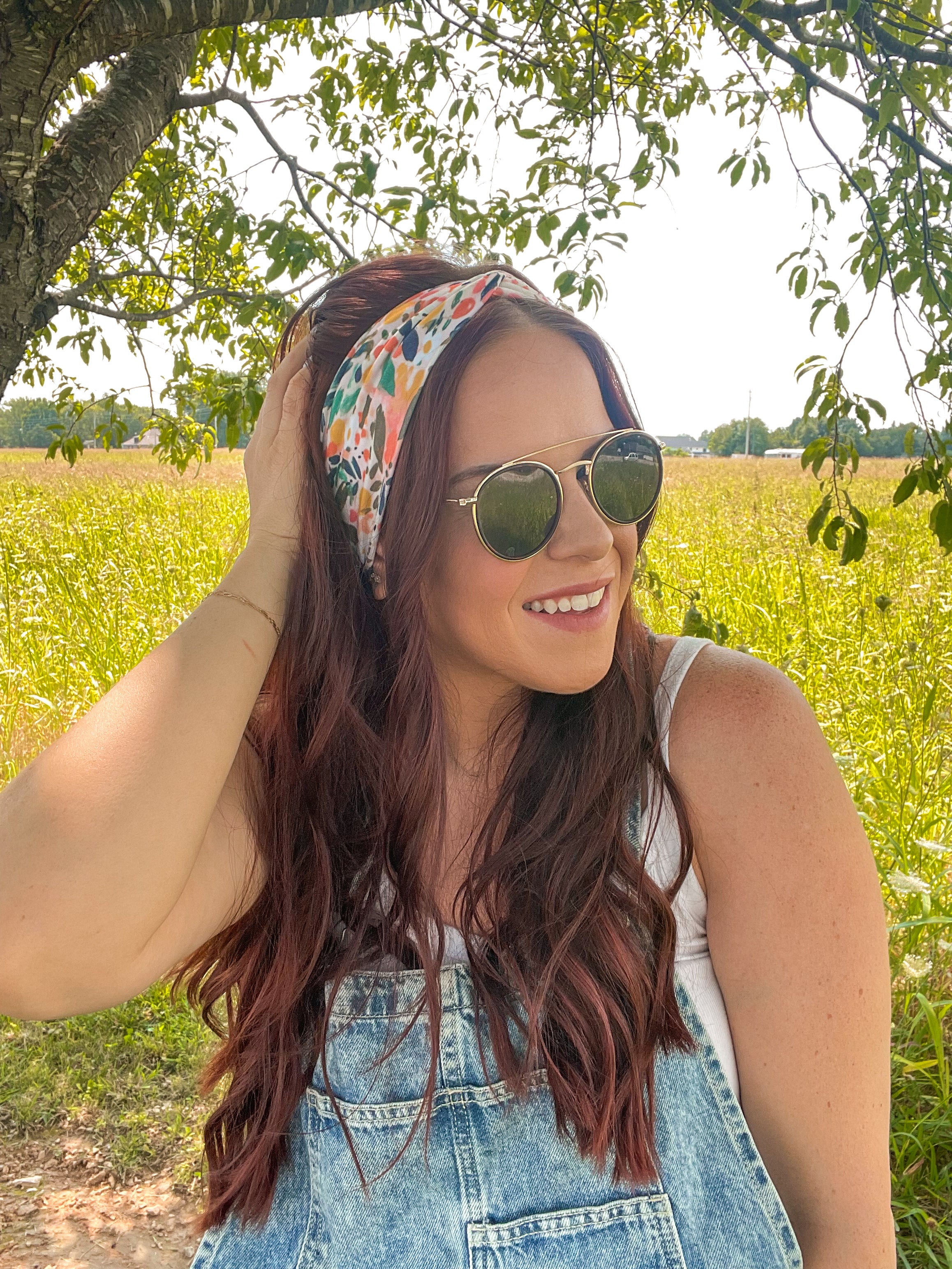 Woman confidently wearing the Simply the Zest headband, capturing its versatile 3-in-1 twist style, perfect for workouts or play.