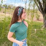 Woman confidently wearing the Woodland Wonder headband for easy hairstyles and comfortable wear.