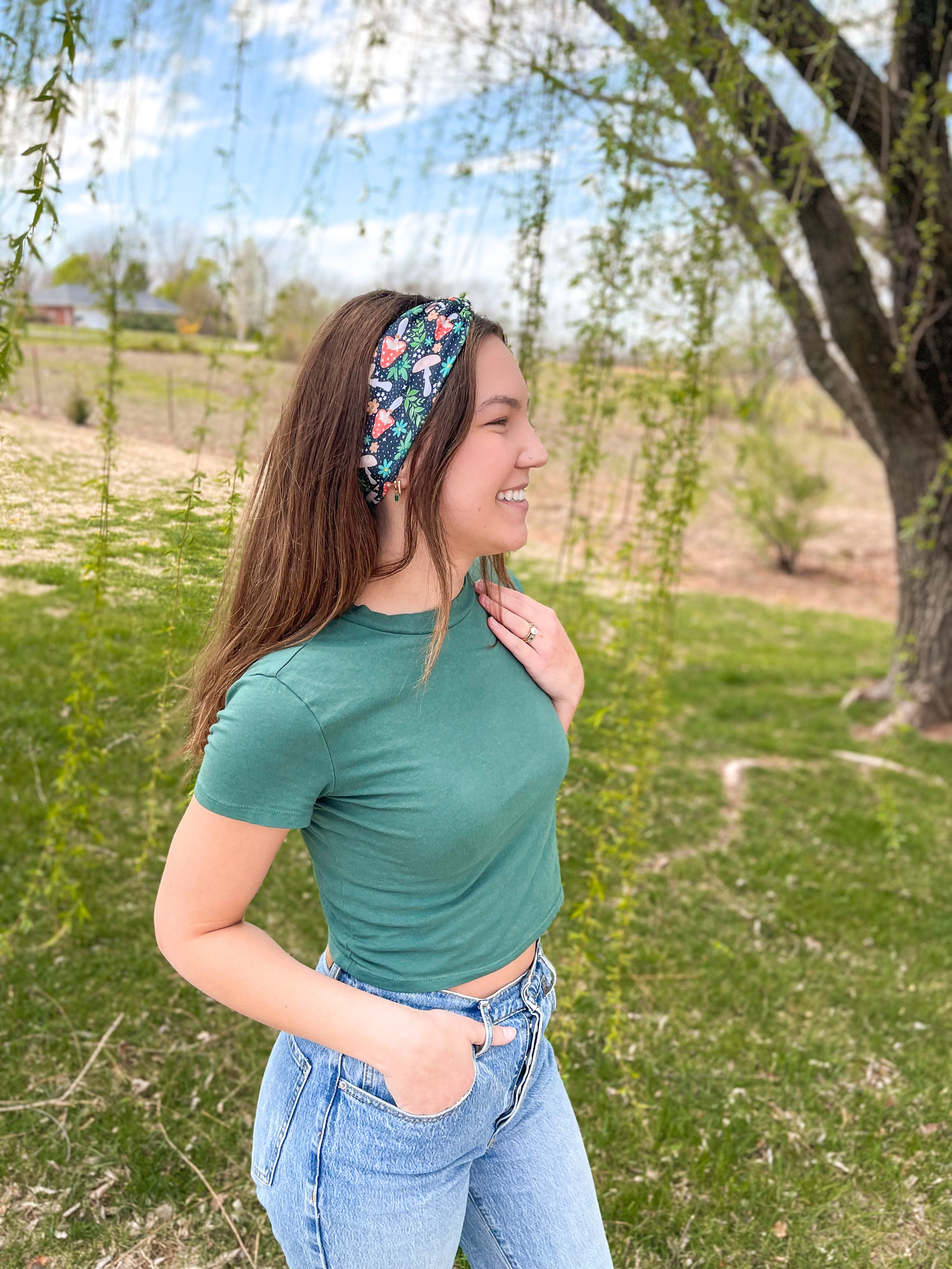 Woman confidently wearing the Woodland Wonder headband for easy hairstyles and comfortable wear.