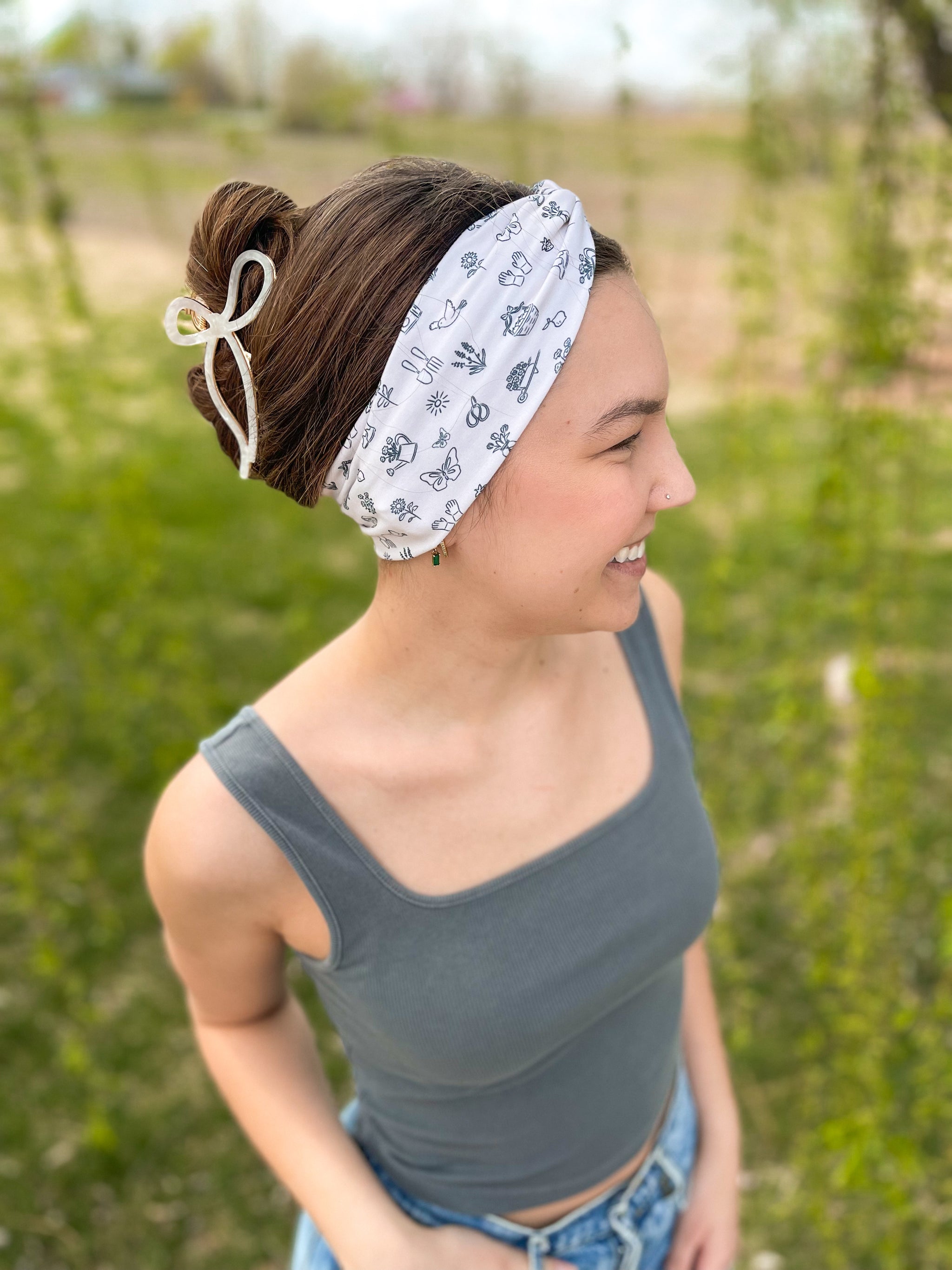 Woman confidently wearing the The Gardener headband for easy hairstyles and comfortable wear.