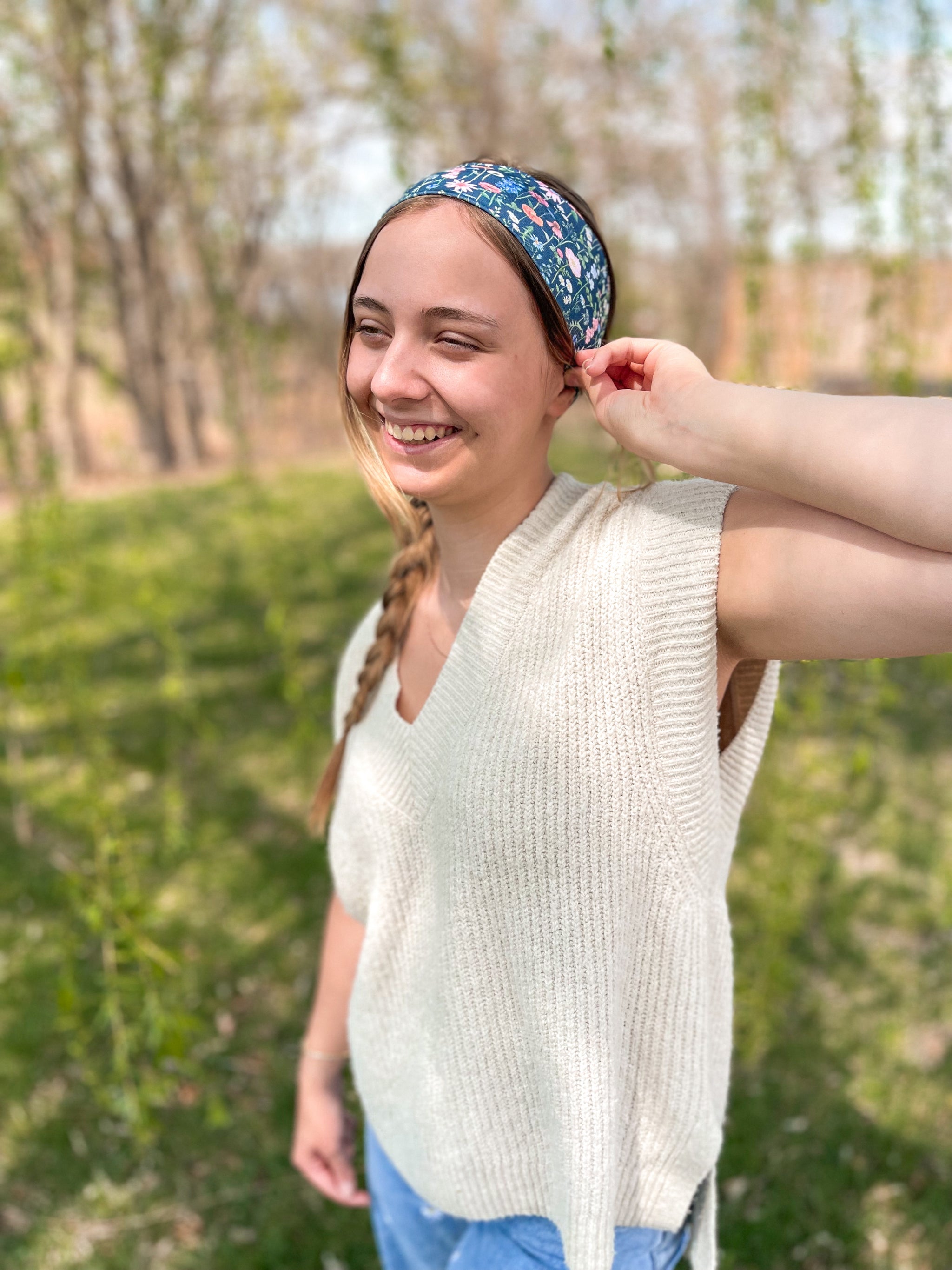 Woman confidently wearing the Violet Floral on Black headband for easy hairstyles and comfortable wear.