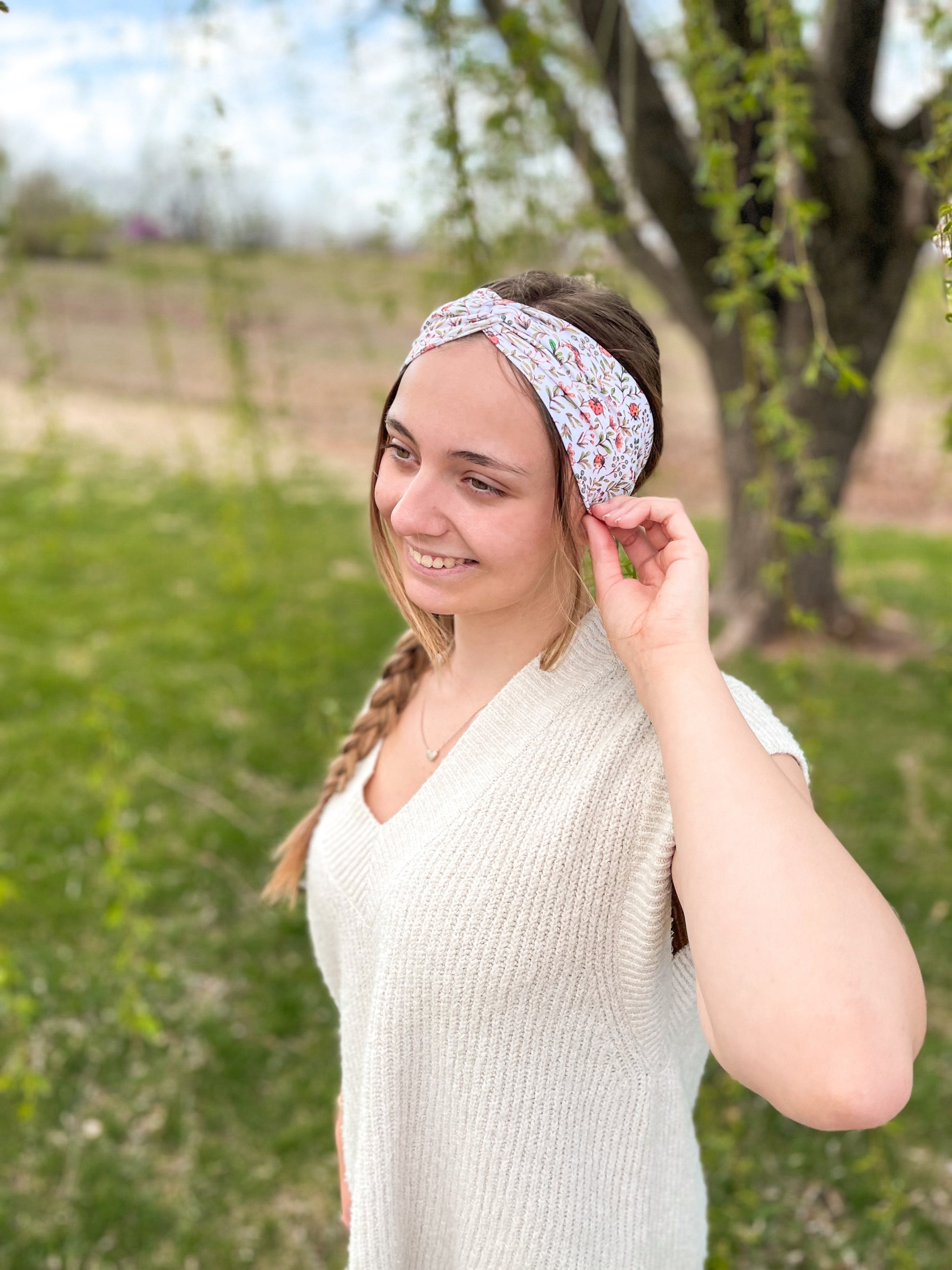 Woman confidently wearing the Lovebug headband for easy hairstyles and comfortable wear.