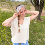 Woman confidently wearing the Lovebug headband for easy hairstyles and comfortable wear.