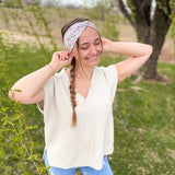 Woman confidently wearing the Lovebug headband for easy hairstyles and comfortable wear.