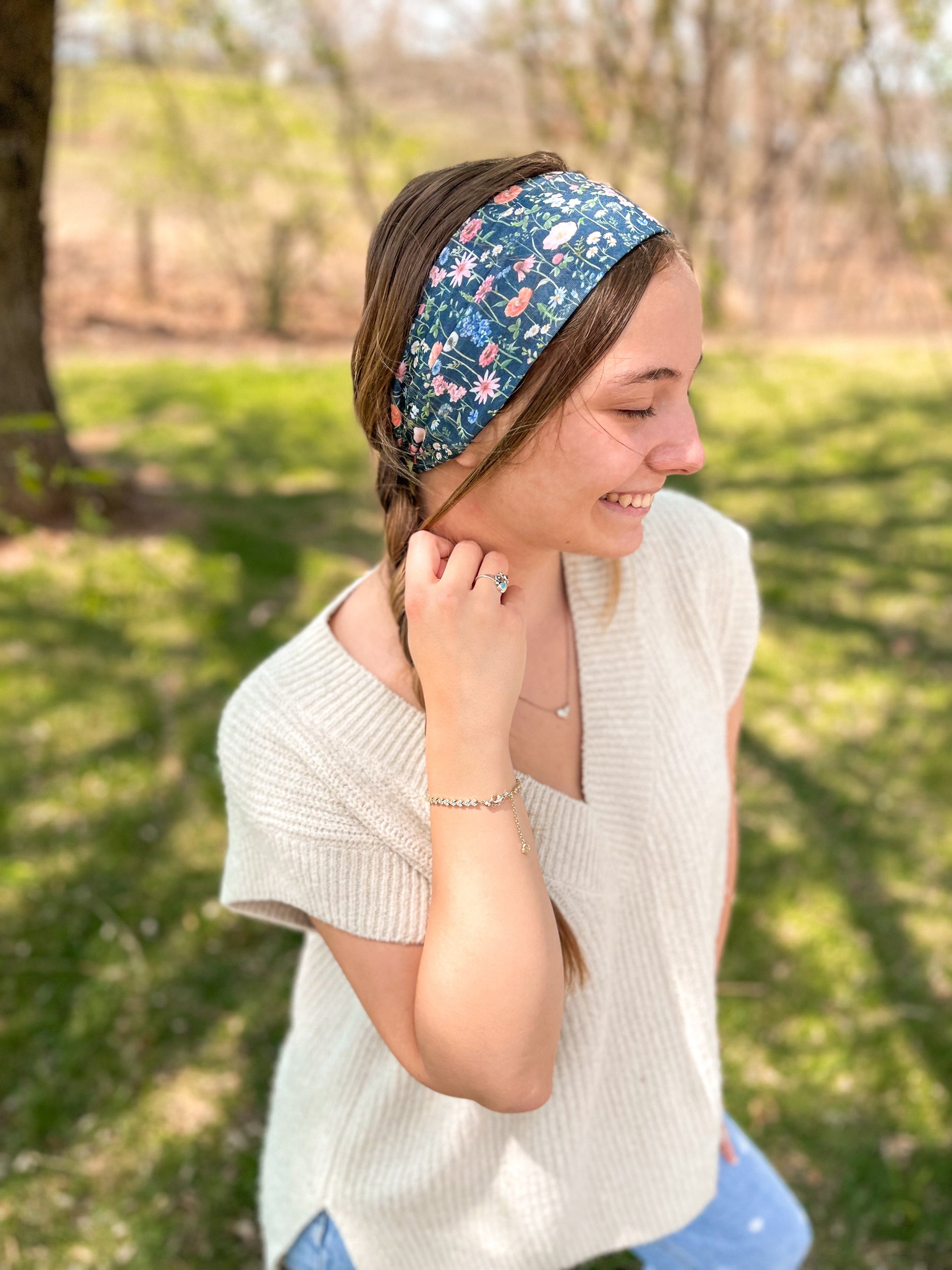 Woman confidently wearing the Violet Floral on Black headband for easy hairstyles and comfortable wear.