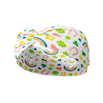 A versatile, functional white headband with colorful rainbow, clover, horseshoe, heart and star designs, perfect for workouts, shifts, or play days.