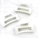Hair claw clip in white, mocha or black in a rectangle shape