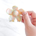 Hair claw clip in pink, yellow, or green marble in a flower shape